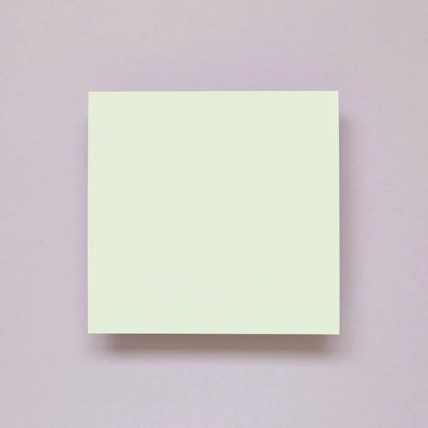 White memo pad, empty paper on purple background. top view, copy space