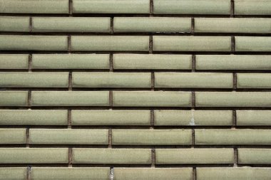 Haki yeşil kiremit duvar dokusu arkaplanı