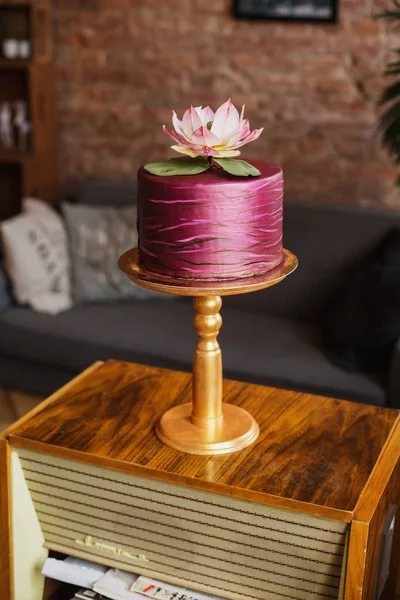 An example of three beautiful wedding cakes from a pastry chef. Elegant and unusual design with edible gold and sugar flowers