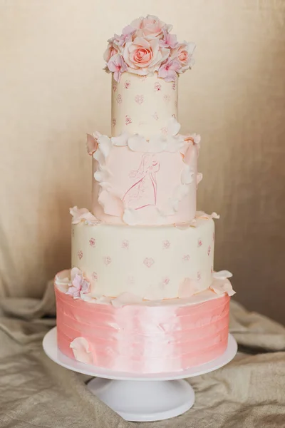 An example of three beautiful wedding cakes from a pastry chef. Elegant and unusual design with edible gold and sugar flowers