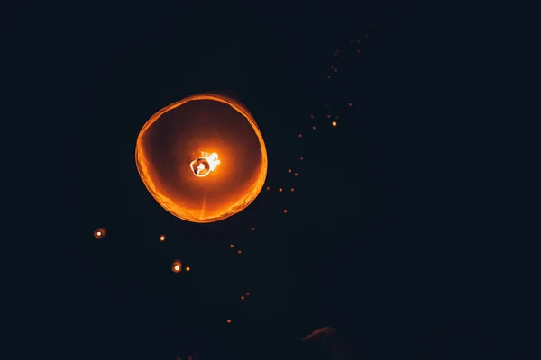Lighting candles, lanterns in the sky at night in the Lantern Fe