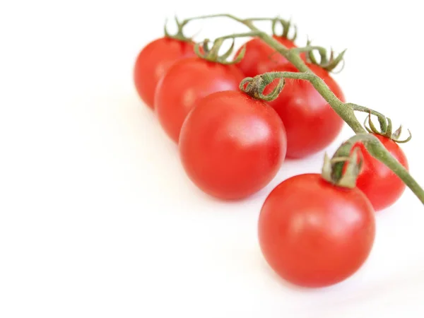 Red tomatoes isolated on the white — Stock Photo, Image