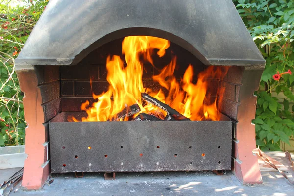 Fire from the brazier under a canopy — Stock Photo, Image