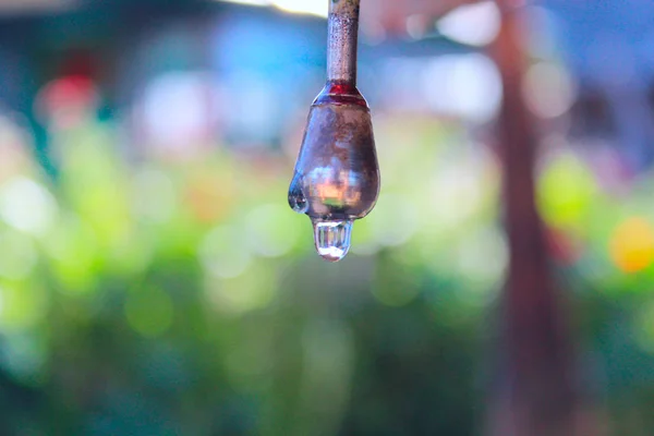 Drop of water dripping from the washbasin — Stock Photo, Image