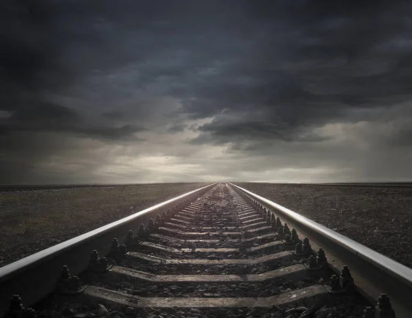 Rails going away into the landscape distance — Stock Photo, Image