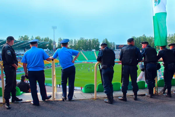 Policemen standing guard over order in the stadium during football match — Stock Photo, Image