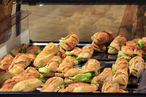 Rolls on the shelves of supermarket — Stock Photo, Image