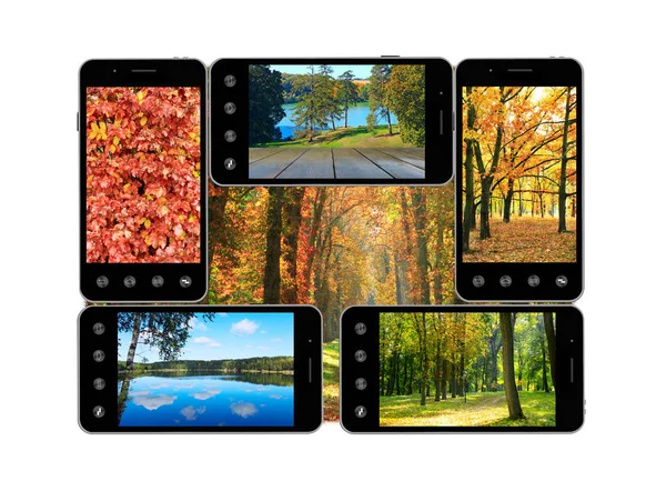 Mobiltelefoner med bilder av hösten. Modern kommunikation. — Stockfoto