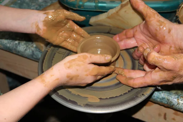 Pottery making process. Ceramic from clay. Potters in work. Art of pottery