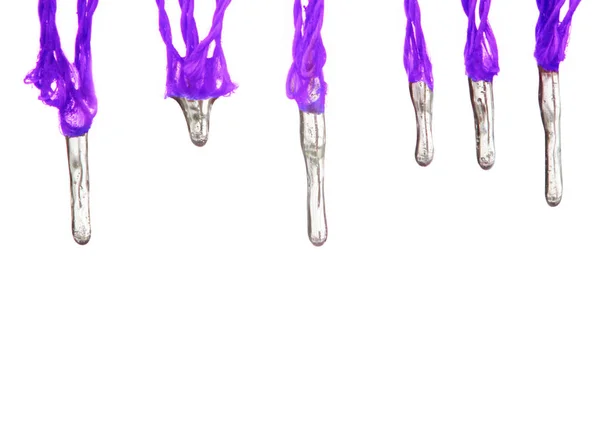 Violet icicles hang down from cords isolated — Stock Photo, Image