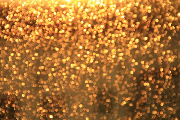 Bokeh dorato. Texture con astrazione in oro. Raggi luminosi — Foto Stock