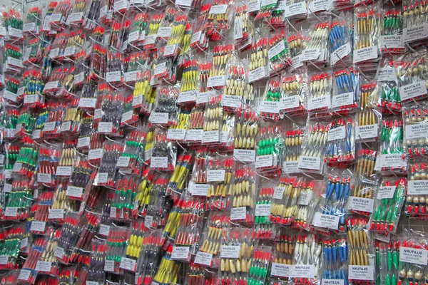 Colorful fishing floats on sale in supermarket. Fishing bobs are sold in store — Stock Photo, Image