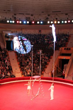 Gomel / Belarus - May 20, 2018 : Circus number. Man equilibrist showing tricks during performance of gymnasts in circus. Gymnasts equilibrists under circus dome