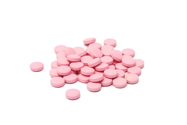 Розовые таблетки таблетки таблетки лекарства изолированы — стоковое фото
