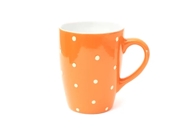Orange dotted cup for tea isolated