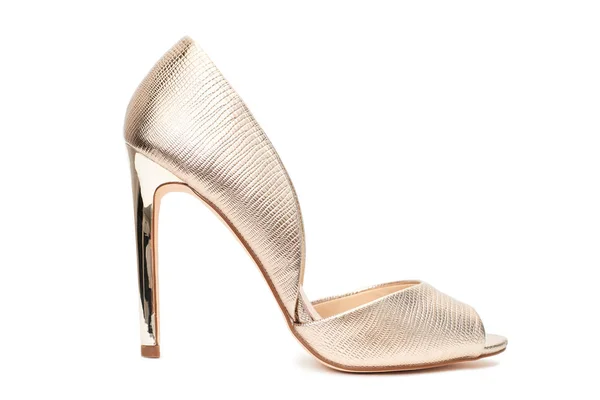 Золотая женская обувь — стоковое фото