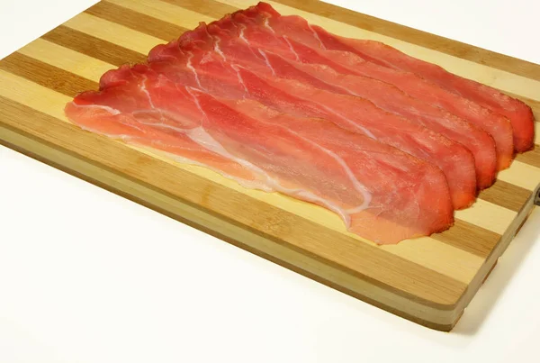 Italian speck, smoked tasty ham — Stock Photo, Image