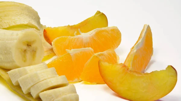 Banan, apelsin och persika — Stockfoto