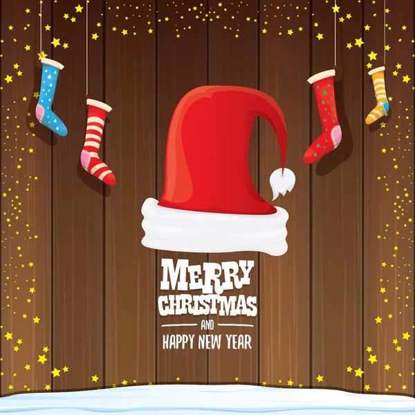 Vector red Santa hat with christmas socks and greeting text Merry Christmas and Happy new year on wooden background. — Stock Vector
