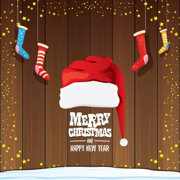 Vector red Santa hat with christmas socks and greeting text Merry Christmas and Happy new year on wooden background. — Stock Vector