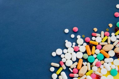 Heap of medicine pills.frame made from colorful pills and capsules.Drug prescription for treatment medication. Pharmaceutical medicament,health care. Pharmacy theme, medicine antibiotic concept.Copy