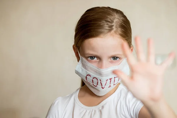 Virus mask girl wearing face protection in prevention for coronavirus showing gesture Stop Infection.Health protection and prevention during flu and infectious outbreak. child girl in medical
