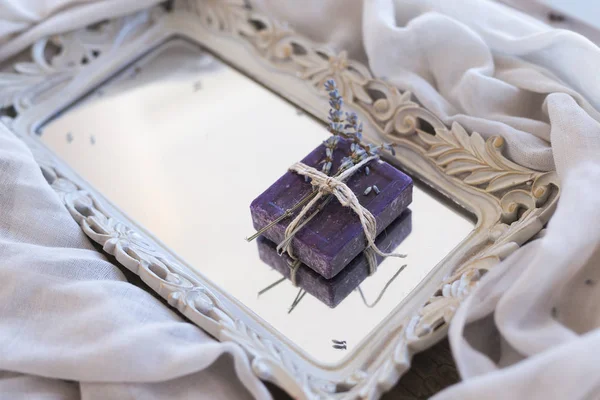 Lavender soap tied with a thread on the mirror tray