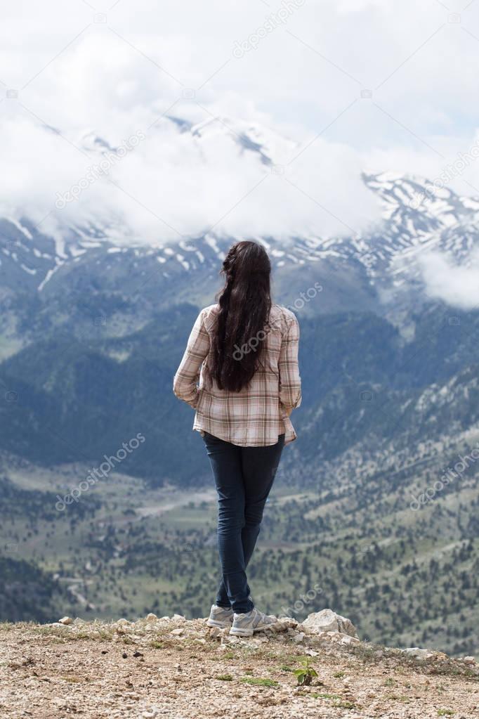 Woman traveller enjoying mountain view