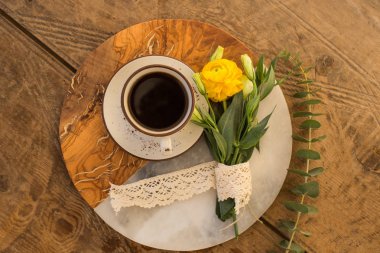 Black coffee and yellow ranunculus clipart