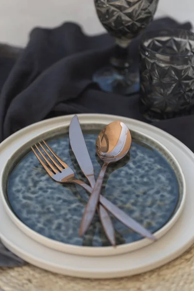 Table styling with black and white stoneware and copper color cu