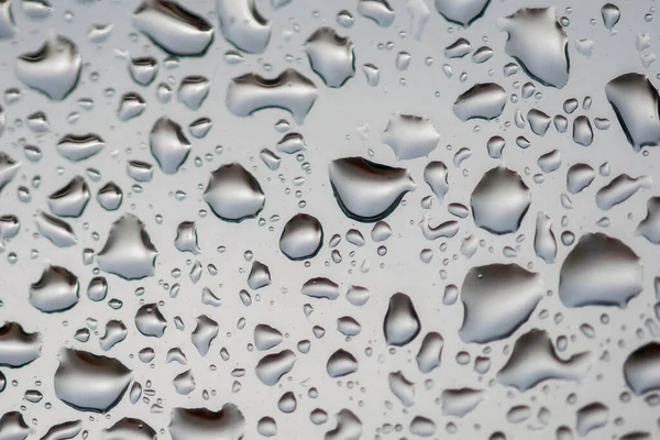 close up raindrops on my window on a rainy day in Marbella, Spain