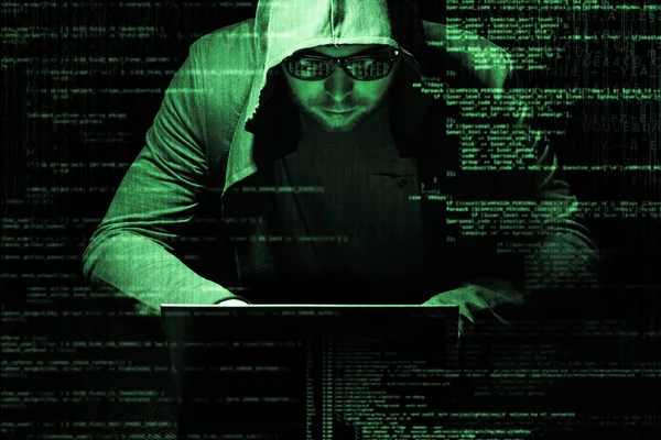 Internet criminaliteit concept. Hacker bezig met een code op donkere digitale achtergrond met digitale interface rond. — Stockfoto