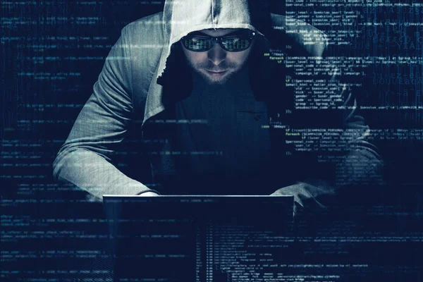 Internet criminaliteit concept. Hacker bezig met een code op donkere digitale achtergrond met digitale interface rond. — Stockfoto