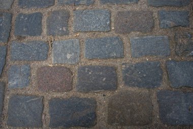 Antik mermer antik Arnavut kaldırımlı sokak dokusu. Doku ve arka plan kaldırım.