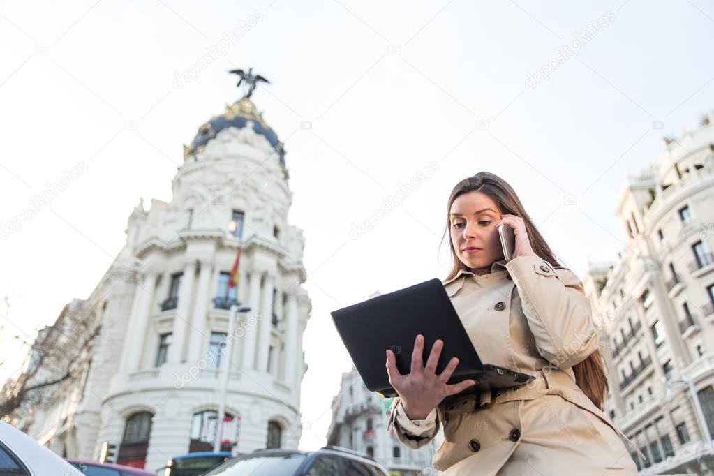 young businesswoman talking on phone outdoor