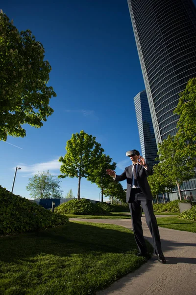 Businessman using virtual reality glasses Stock Photo