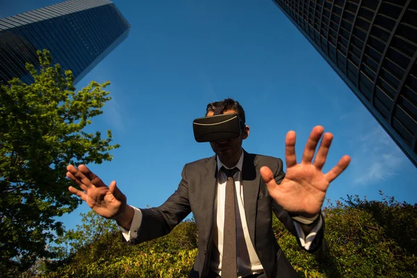 Businessman using virtual reality glasses Stock Picture