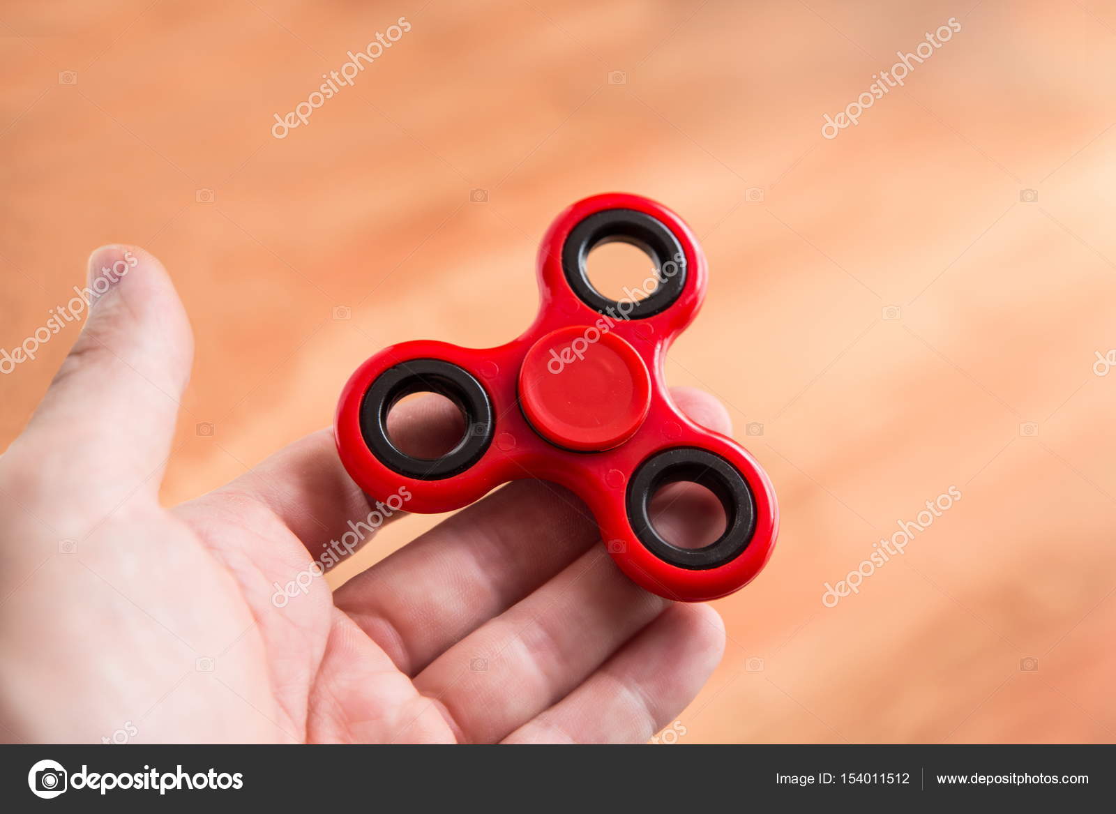 Man holding a fidget spinner Stock Photo by ©manuelfrommadrid 154011512