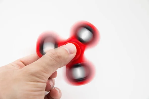 Man playing with fidget spinner — Stock Photo, Image