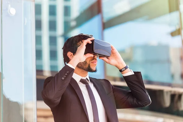 afro businessman playing virtual reality simulation