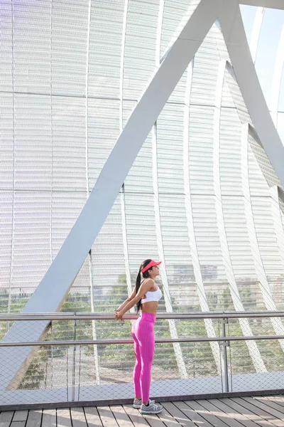 Fit woman runner stretching outdoors Royalty Free Stock Photos