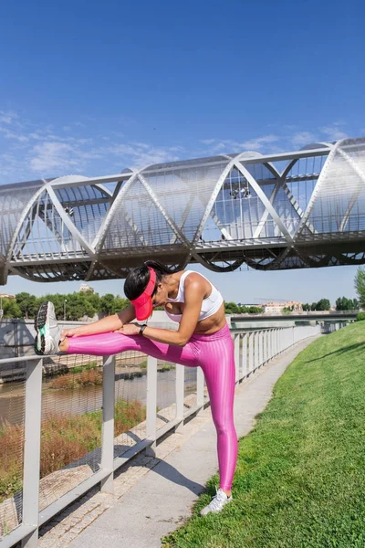 Fit woman runner stretching outdoors Royalty Free Stock Photos