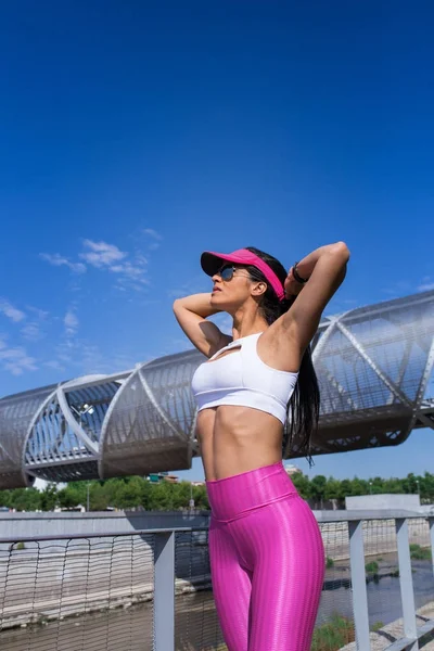 Fit woman runner stretching outdoors Royalty Free Stock Images