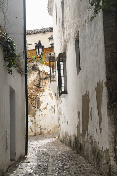 Ronda (Andalucia, Spain): old typical street with white houses