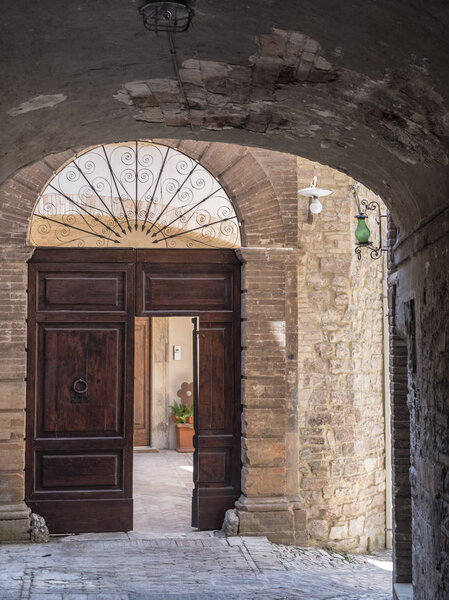 Historic buildings of Spello, medieval city (Perugia, Umbria, Italy). Alley
