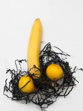 Banana and two lemons, symbol of phallus, flat lay clipart