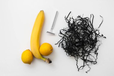 Banana and lemon with razor, shaved man balls clipart