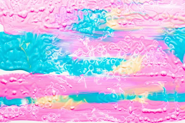 Texturerat utstryk av rosa, blå och gul färg — Stockfoto