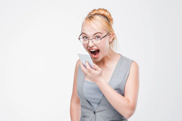 Angry woman with phone furious, enraged and mad — Stock Photo, Image