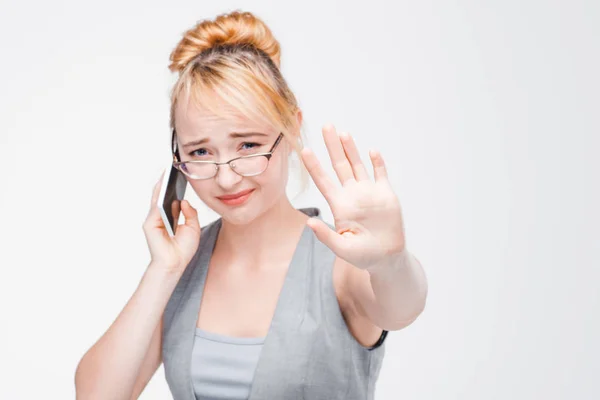 Girl interrupted from talking on phone. Irritation — Stock Photo, Image